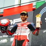 Pembalap muda Indonesia Muhammad Kiandra Ramadhipa saat merayakan kemenangan podium pertama di Sirkuit Estoril Portugal